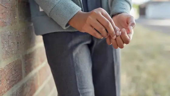 A close-up photograph of a child's hands.
