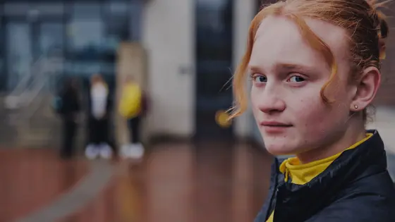 A teenage girl looking thoughtful