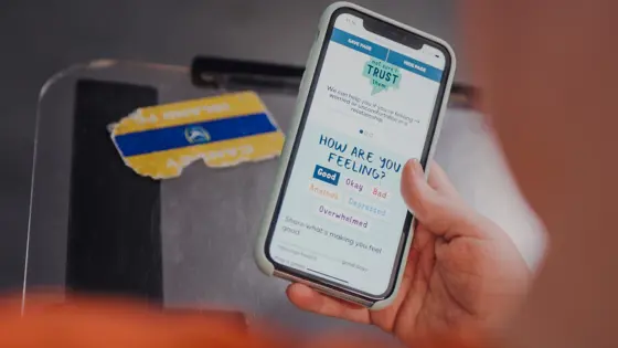 Photo of a teenager looking at the Childline website on their phone